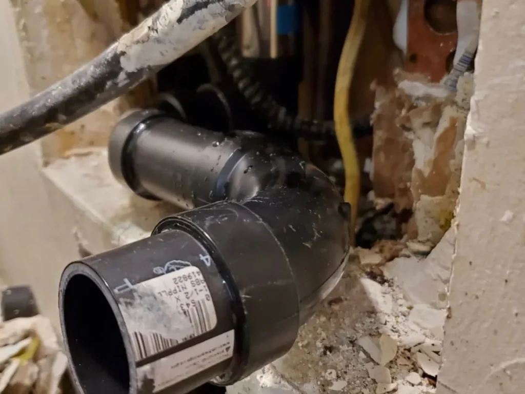 Drain pipe fittings exposed inside a wall