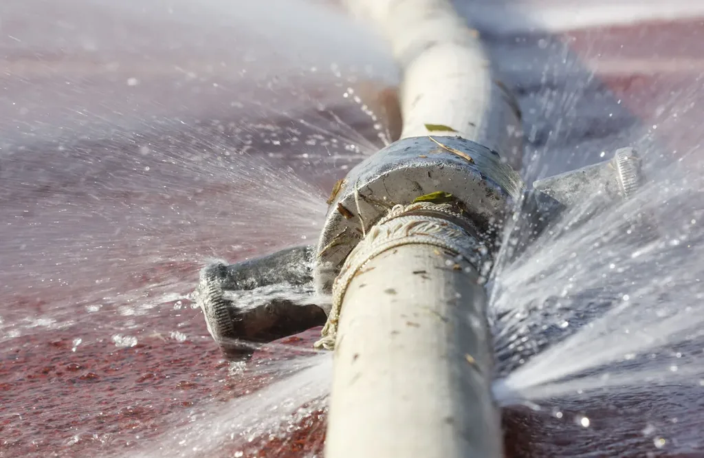 Water spraying from a leaking pipe joint